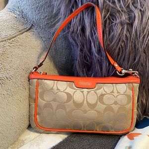 COACH | tan and orange wristlet